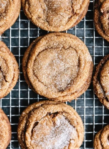 Freshly baked molasses cookies on a plate, ready to enjoy