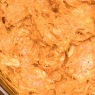 Delicious Crockpot Buffalo Chicken Dip served in a bowl with tortilla chips.