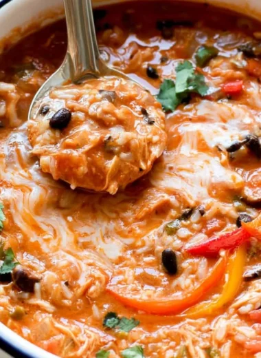 Bowls of Pepper Jack Chicken Fajita Soup with colorful vegetables and rice