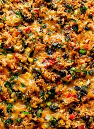 Protein-packed burrito bake topped with cheese and fresh ingredients.