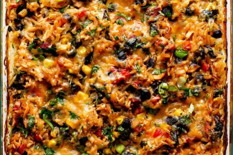 Protein-packed burrito bake topped with cheese and fresh ingredients.