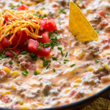 Delicious Sausage Queso Dip served with tortilla chips