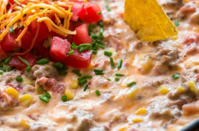 Delicious Sausage Queso Dip served with tortilla chips