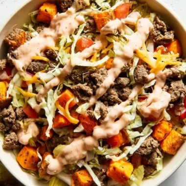 Sweet Potato Burger Bowl topped with ground beef and fresh ingredients