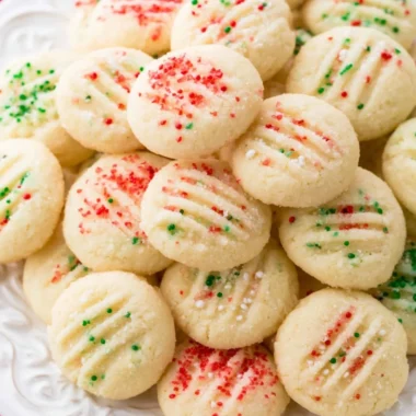 Delicious whipped shortbread cookies on a plate, perfect for any occasion.